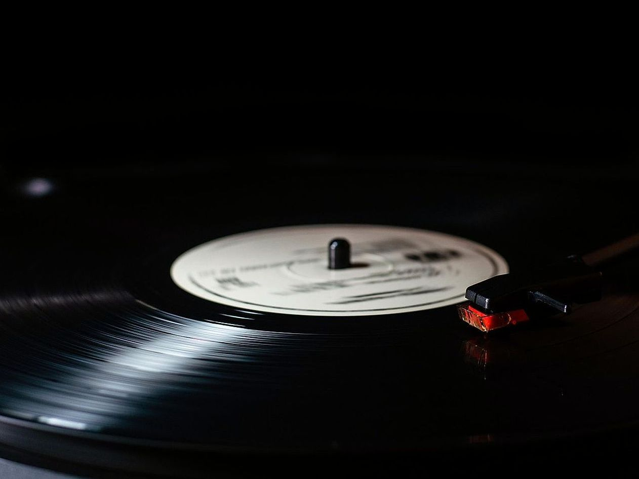 Friends gathered around the air hockey table